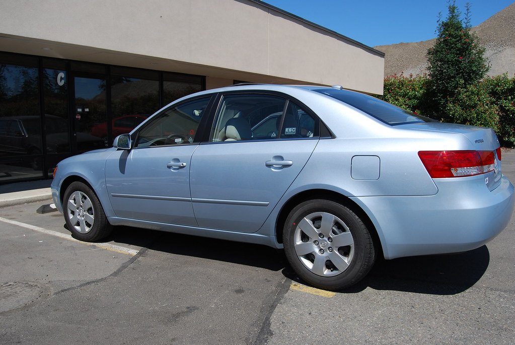 Rental cars in a parking lot, illustrating non-owner vs rental car coverage